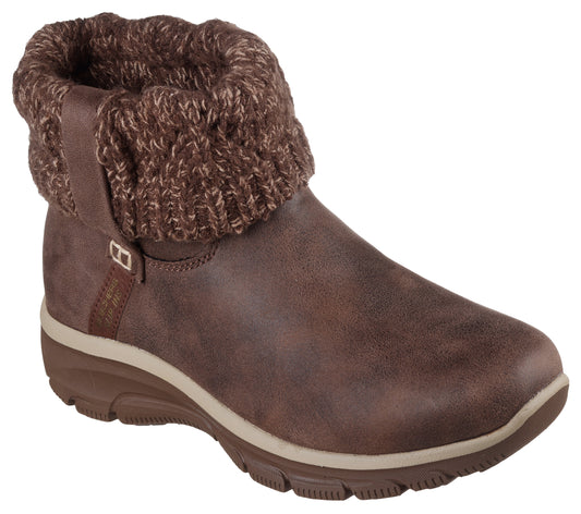 Brown ankle boot with knit cuff and side buckle accent.