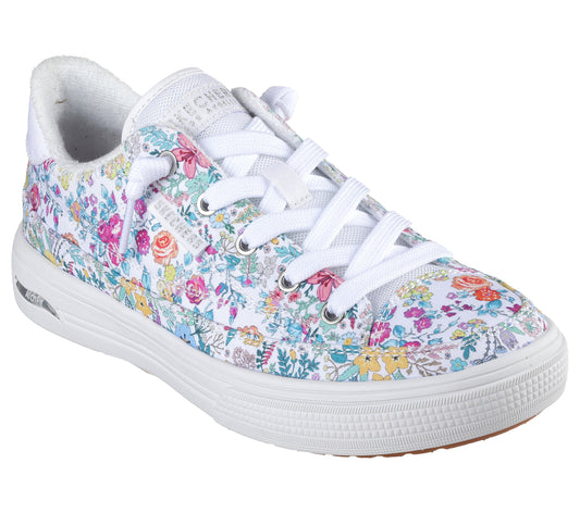 White floral print sneaker with white laces and thick white sole.