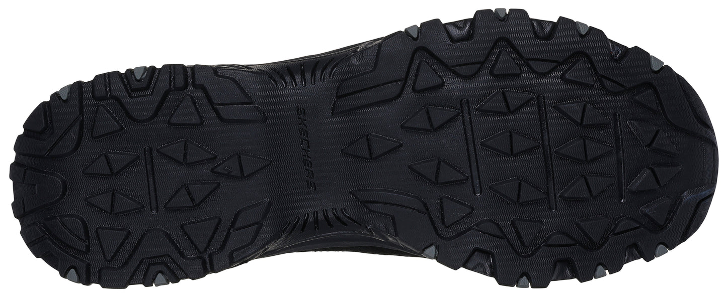 A shoe sole with deep, patterned treads.