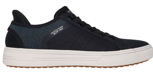A black slip-on sneaker with a white midsole and a brown outsole.
