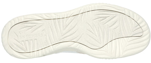 The bottom of a shoe, with a white sole featuring a leaf-like pattern.
