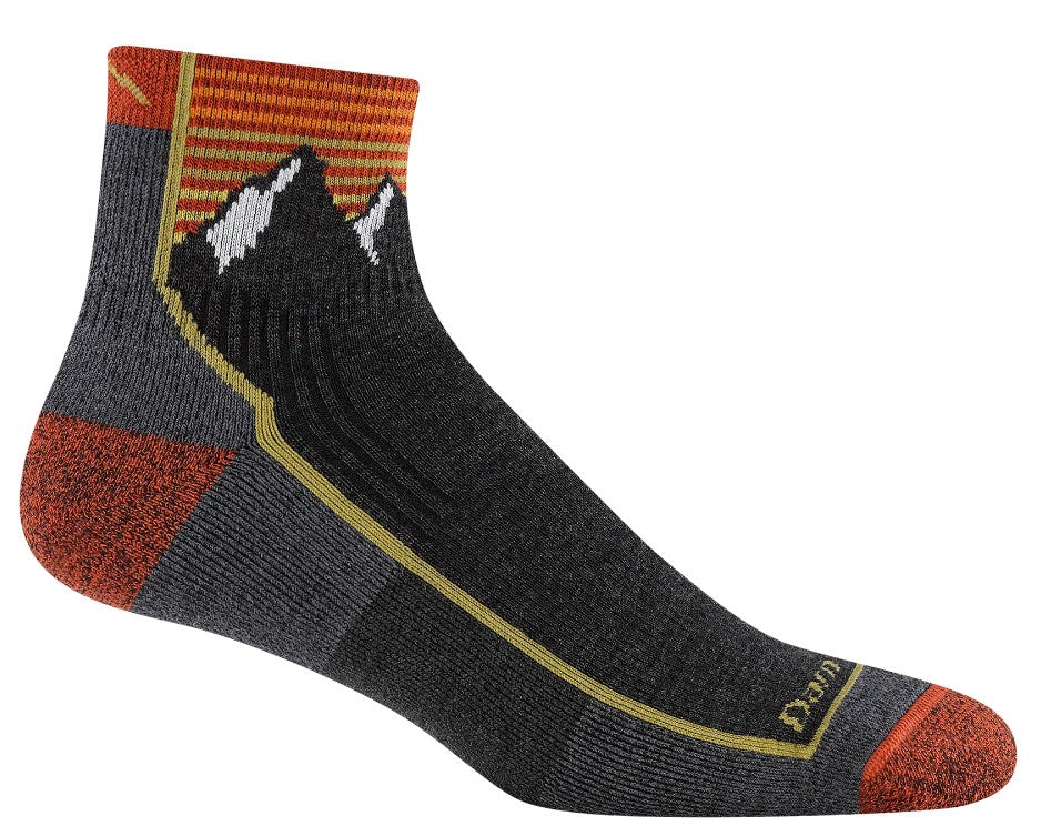 Gray sock with a mountain and sun design at the top and orange heel and toe.