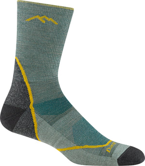 Sage-colored hiking sock with a mountain peak logo, reinforced heel, and yellow accents.