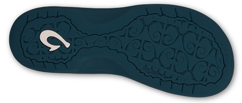 A close-up shows the textured dark blue sole of a sandal with a white hook-shaped design on one end.