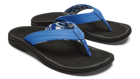 A pair of black flip-flops with blue straps and floral-patterned lining.