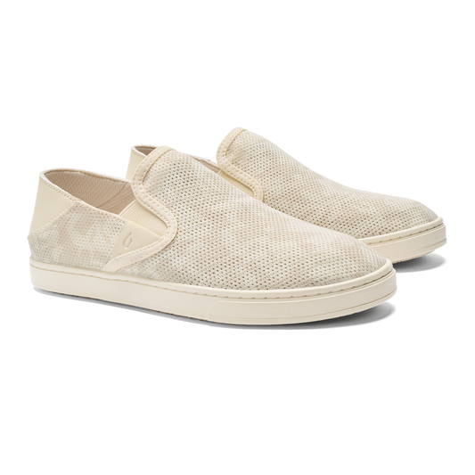 Beige slip-on shoes with a perforated pattern and rubber sole.