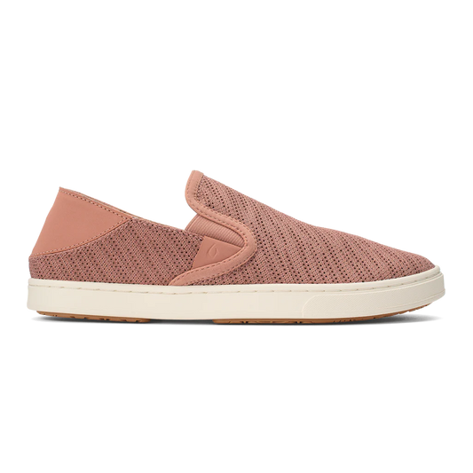 Close-up of a rosy-pink fabric slip-on shoe with a white sole.