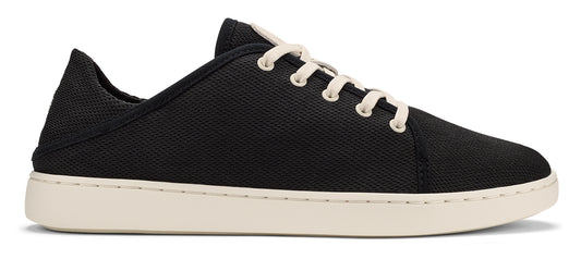 A black canvas sneaker with off-white laces and a white sole.