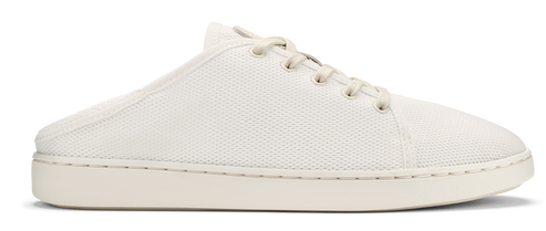 A white, low-top shoe with laces and a rubber sole.
