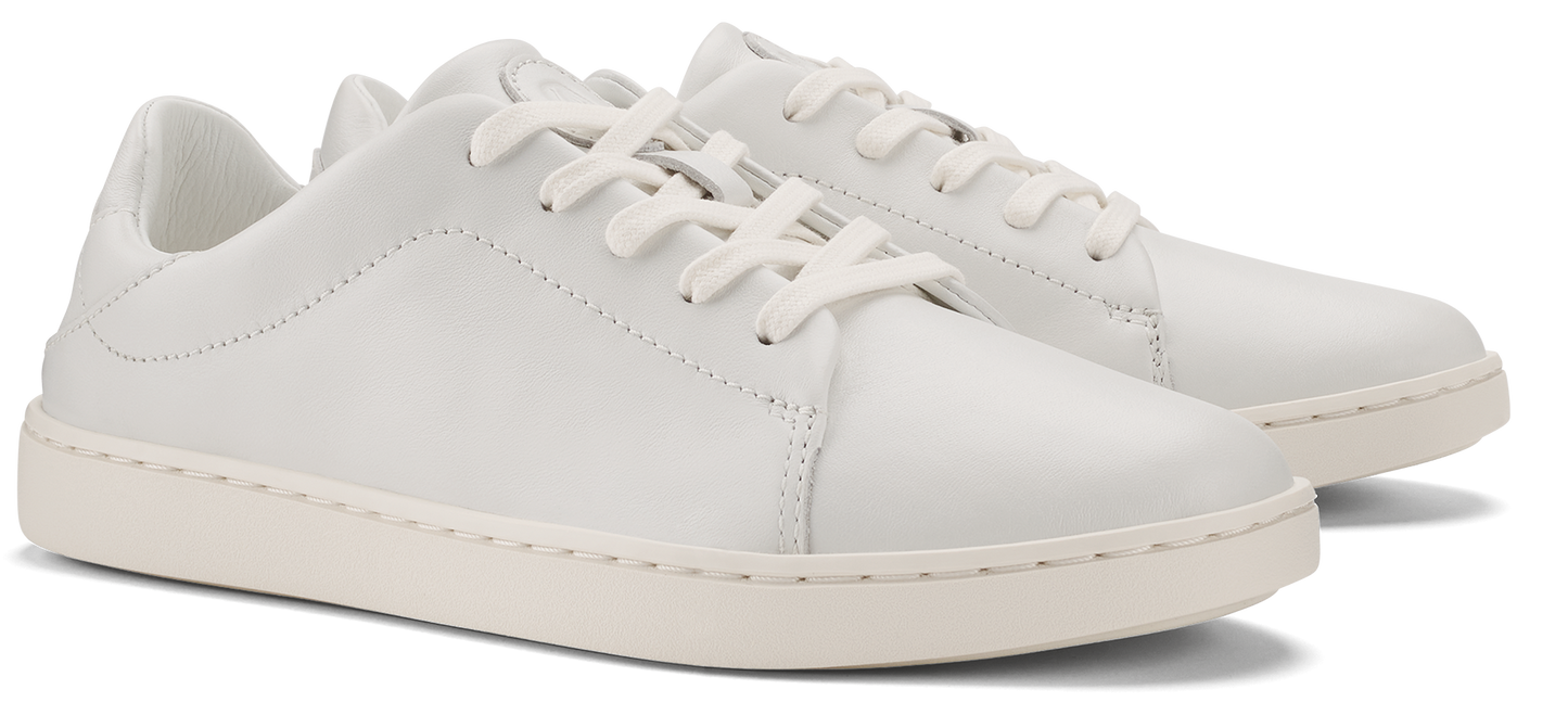 A pair of white leather sneakers with white laces and a white sole.