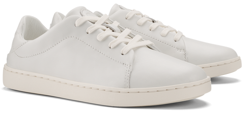 A pair of white leather sneakers with white laces and a white sole.