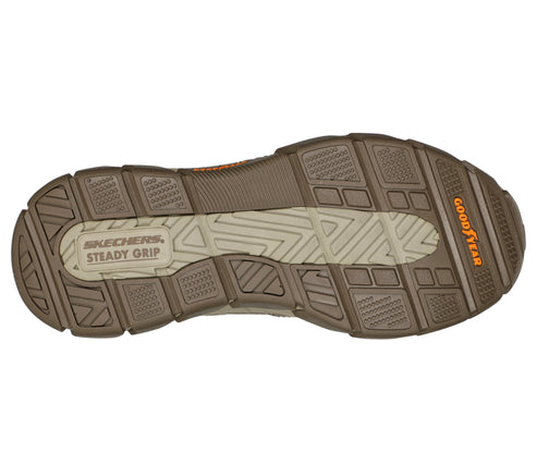 Brown shoe sole with beige tread and "Steady Grip" and "Goodyear" text.