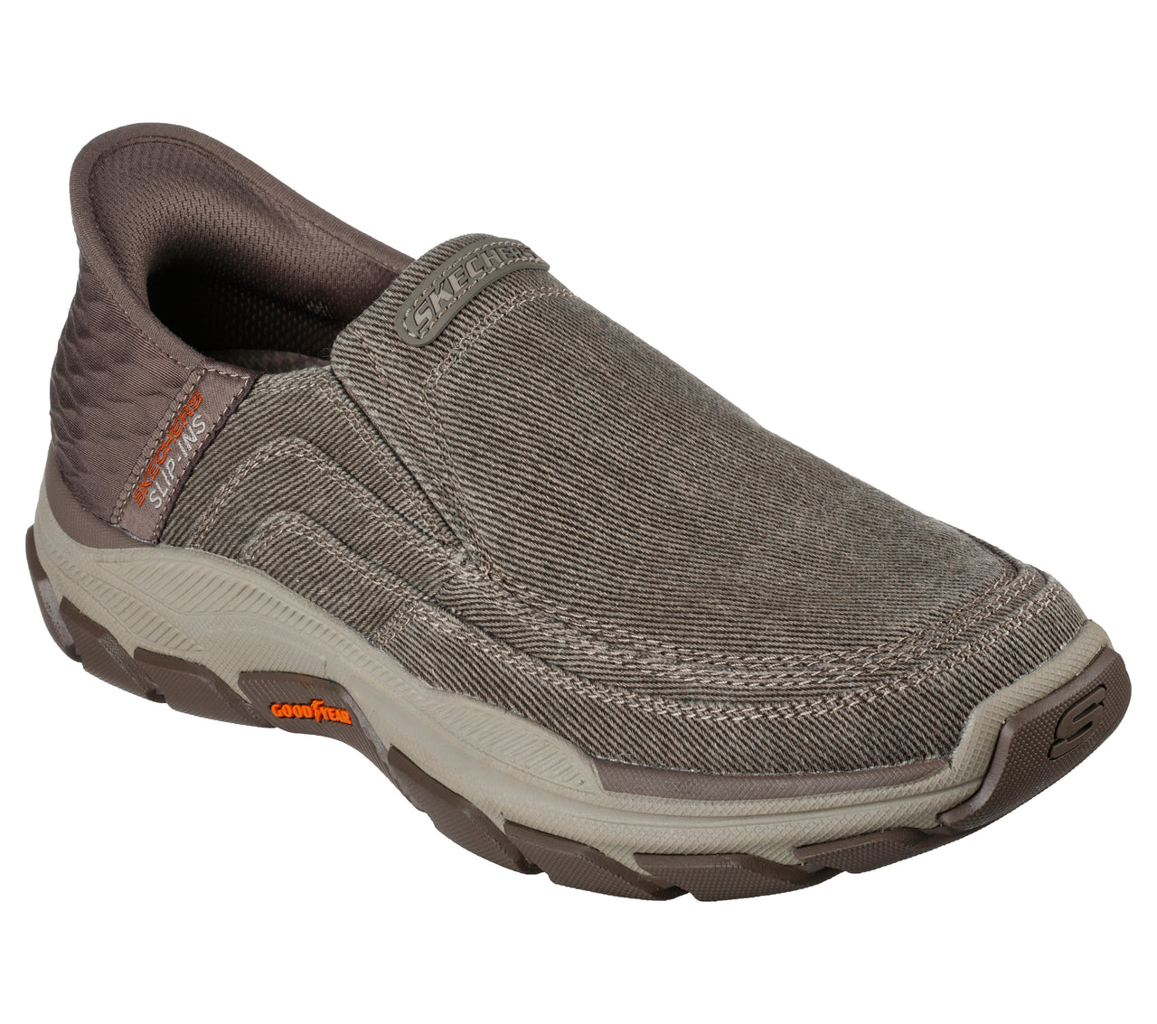 Slip-on shoe with canvas upper, cushioned sole with Goodyear branding and textile heel with Slip-Ins branding.