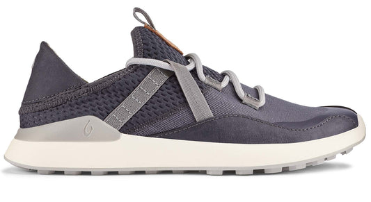 Side view of a gray sneaker with a white sole and a complex gray lacing system.