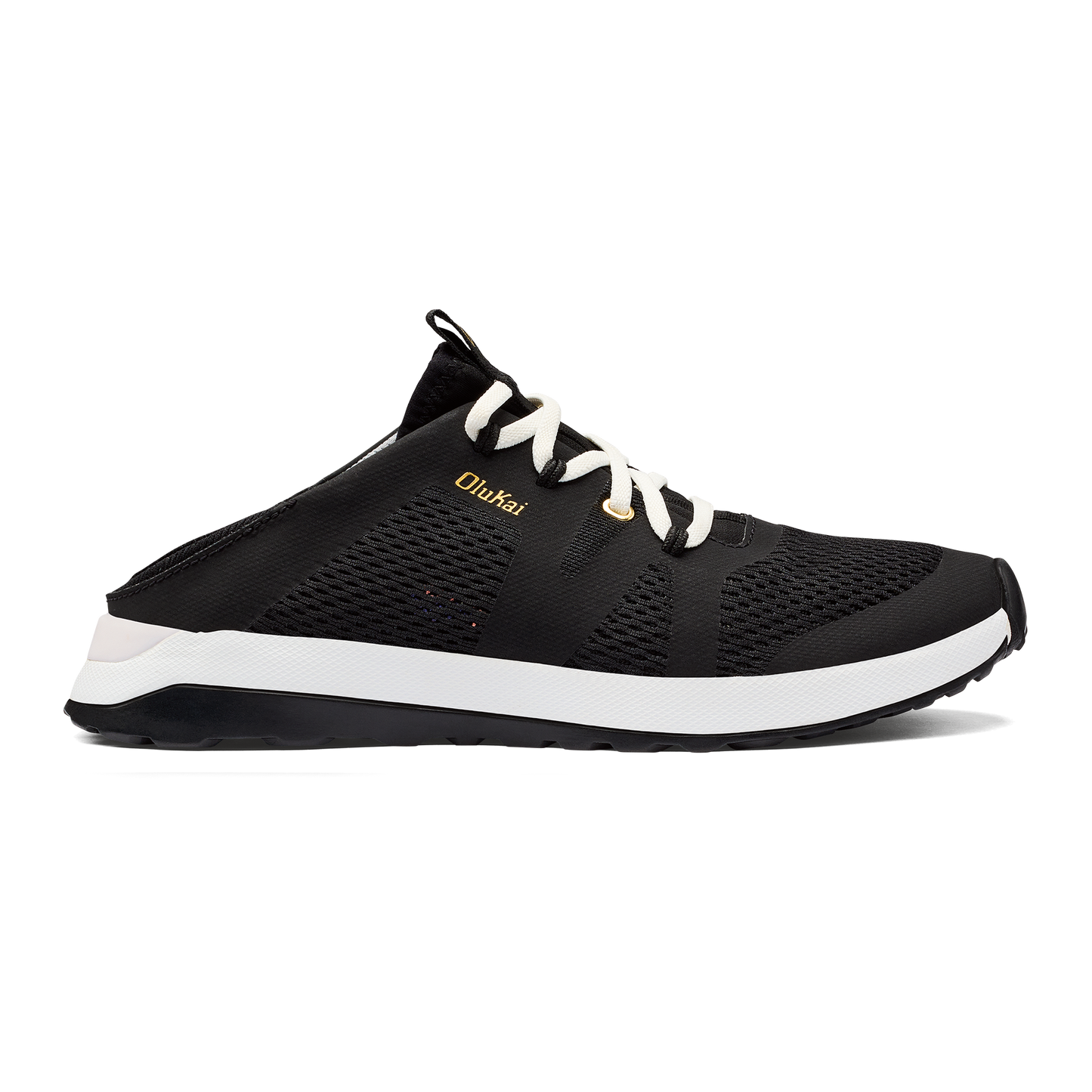Black mule sneaker with white laces and soles; OluKai brand text on the side.
