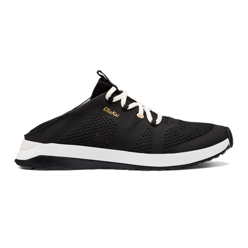 Black mule sneaker with white laces and soles; OluKai brand text on the side.