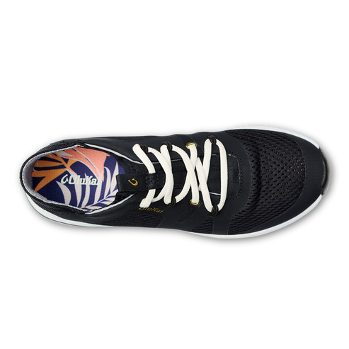 Overhead view of black athletic shoe with white laces and white sole.