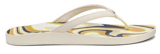 A cream-colored flip-flop with a patterned insole.