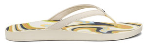 A cream-colored flip-flop with a patterned insole.