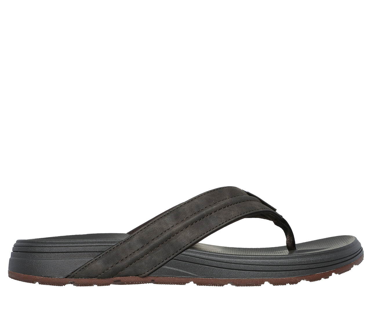 Side view of a gray thong sandal with brown soles.