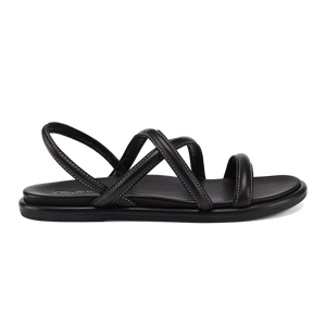 A black leather flat sandal with a back strap and two wide crossed straps over the bridge of the foot, featuring white contrast stitching.