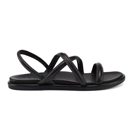 A black leather flat sandal with a back strap and two wide crossed straps over the bridge of the foot, featuring white contrast stitching.