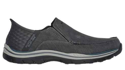A gray slip-on shoe with a pull tab.