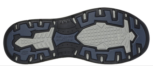 A shoe sole with a textured gray tread.