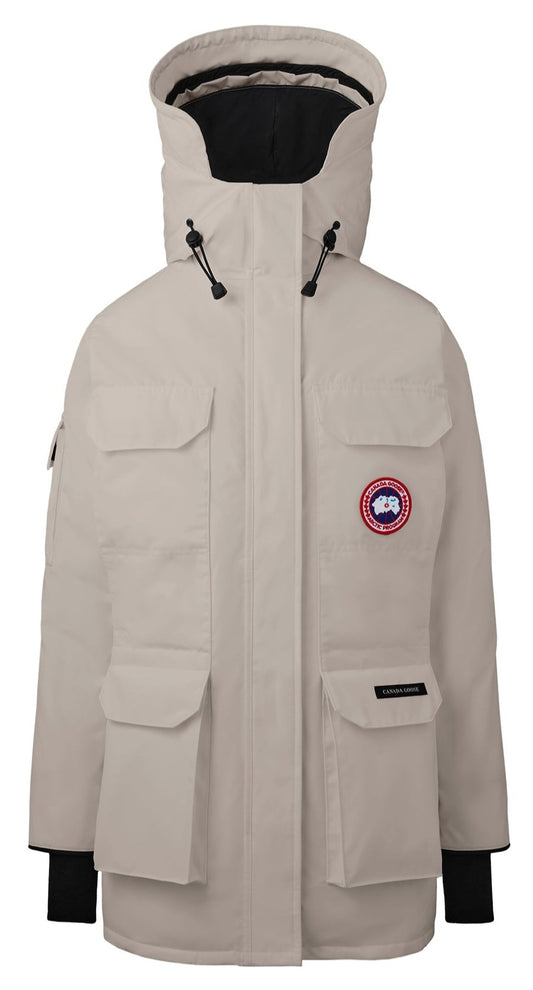 Beige winter parka with a hood and four front pockets.