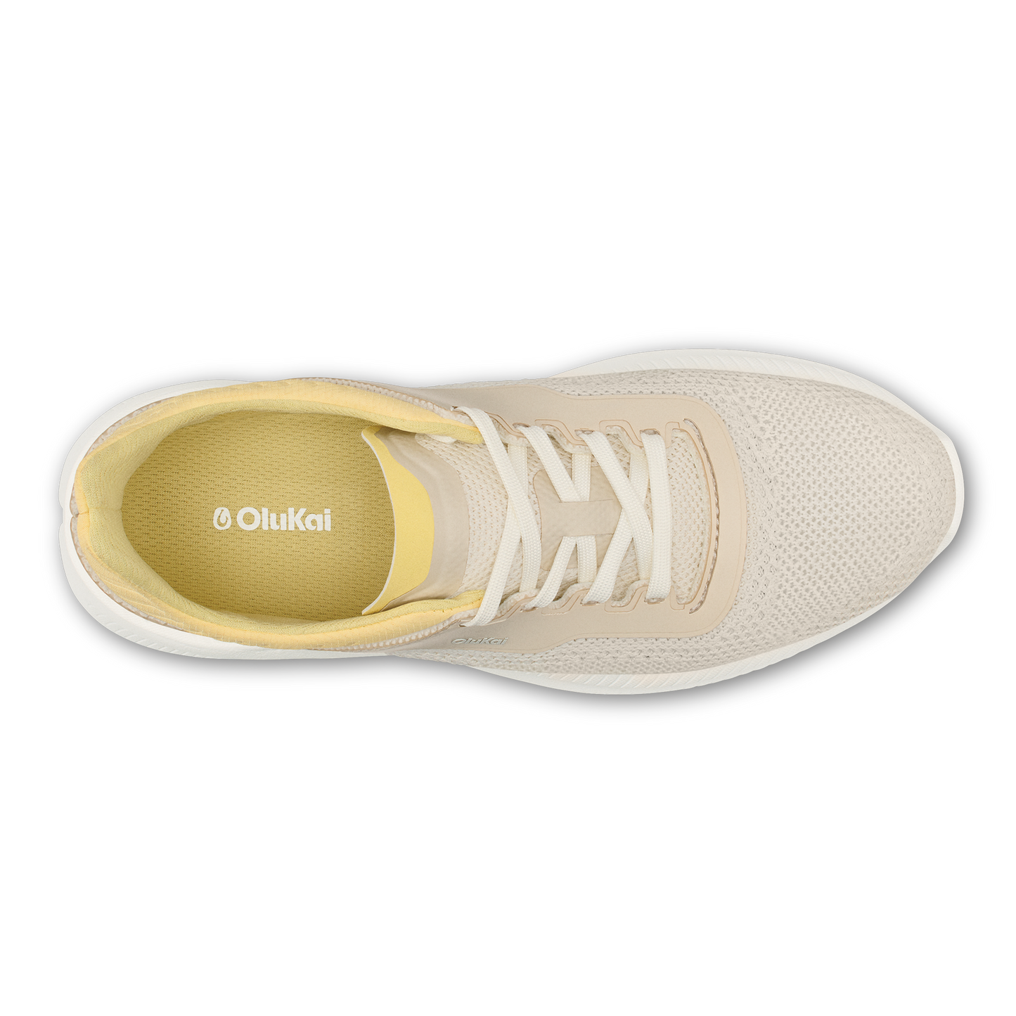 A top-down view of a light beige mesh sneaker with a yellow interior lining and white laces, featuring the text "OluKai" printed on the insole.