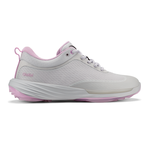 A women's athletic sneaker in light gray with pastel pink accents on the inner lining, heel pull tab, and outsole, featuring a textured side panel, white laces, and the embossed word OlinKai on the side.