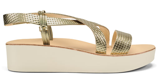 Gold sandal with criss-cross straps and a platform sole.