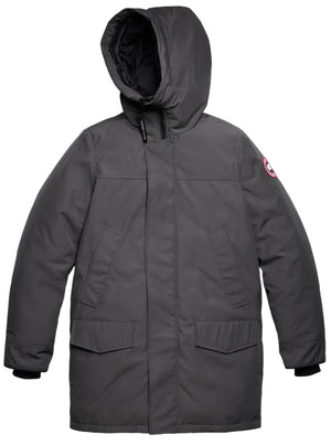 A charcoal grey parka jacket with a large hood, two flap pockets at the waist, ribbed cuffs, and a circular emblem patch on the left upper sleeve.