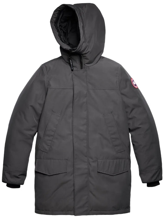 A charcoal grey parka jacket with a large hood, two flap pockets at the waist, ribbed cuffs, and a circular emblem patch on the left upper sleeve.