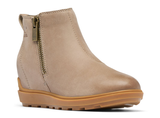 Tan ankle boot with side zipper and wedge heel.
