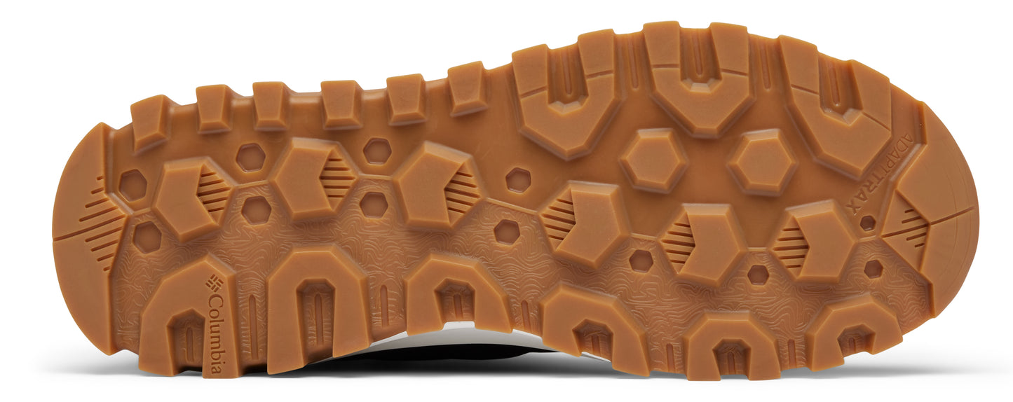 Brown lug sole of a shoe with the brand 'Columbia' imprinted on it.