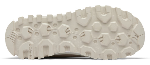 Beige shoe sole with a pattern of hexagons and cylinders.