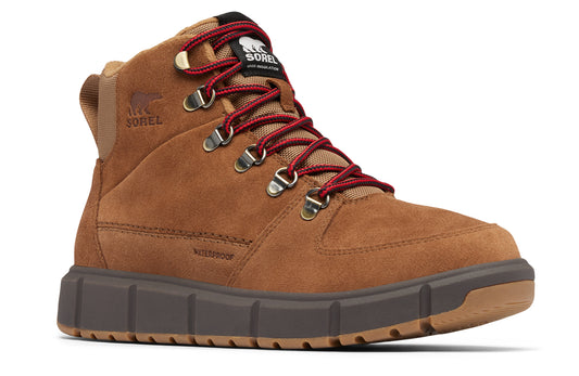 High top tan suede boot with red laces and a black tongue label.