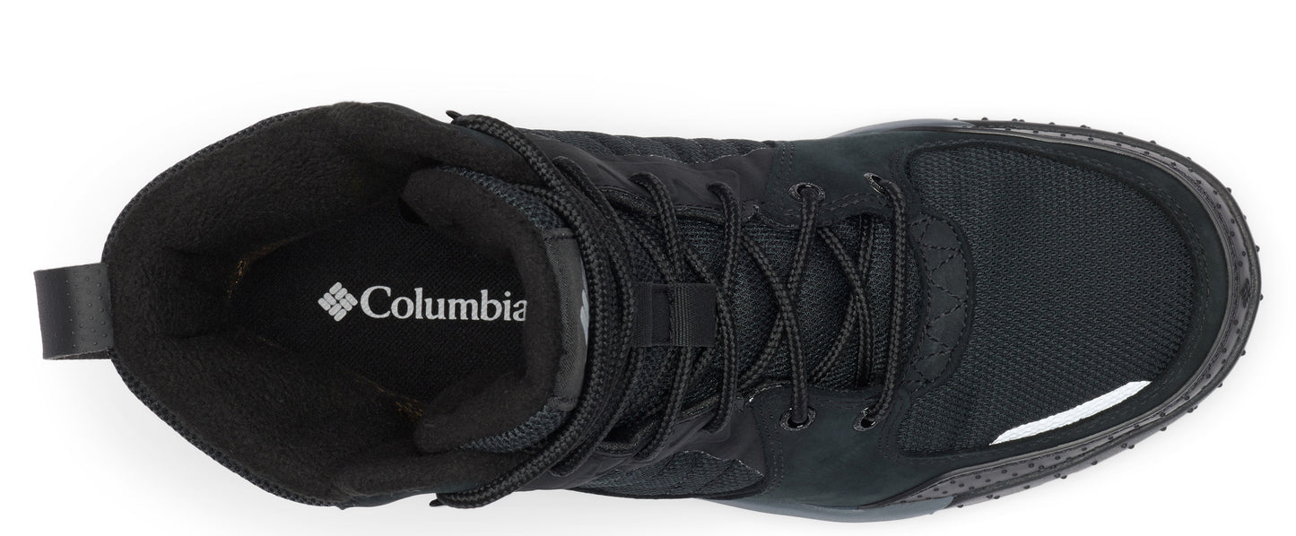 Top-down view of a black, high-top hiking shoe with laces, featuring a visible "Columbia" logo on the inner sole.