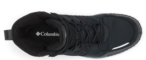 Top-down view of a black, high-top hiking shoe with laces, featuring a visible "Columbia" logo on the inner sole.