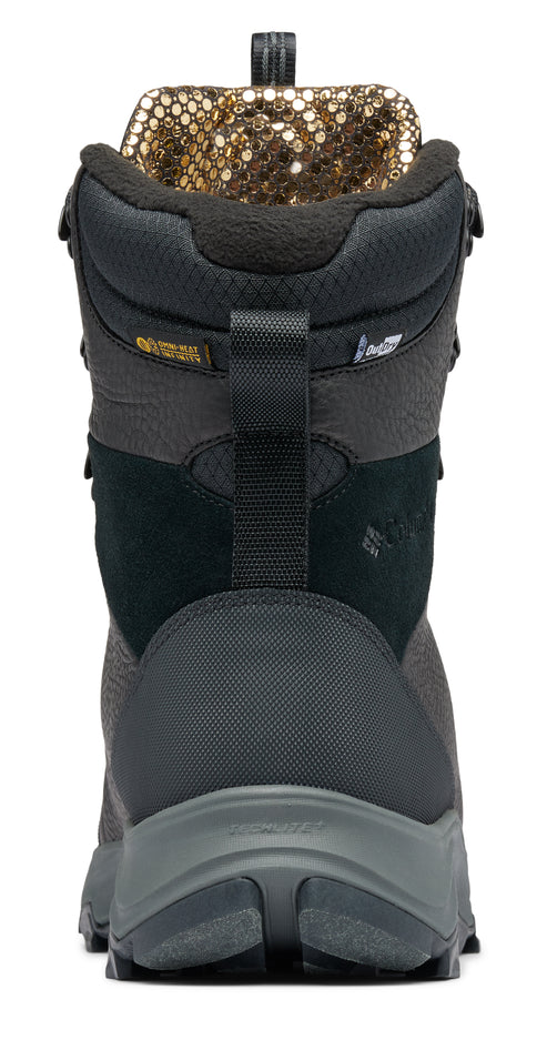 Back of a gray and black hiking boot with a patterned gold and black lining.