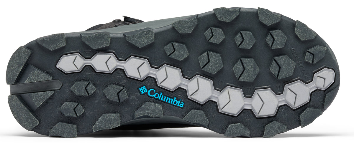 A shoe sole with gray hexagonal and arrow-shaped treads, and a blue "Columbia" logo.