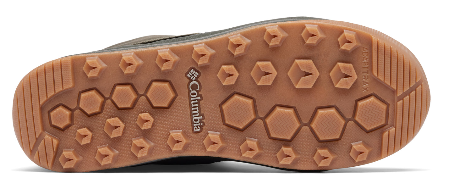 The underside of a shoe with a brown sole that has a pattern of hexagons and other shapes.