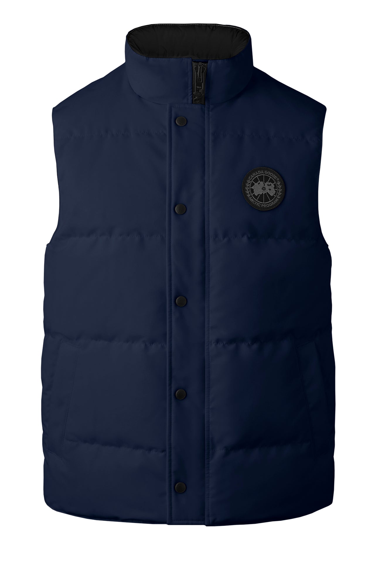Navy puffer vest with black button closures and a circular logo on the right chest.