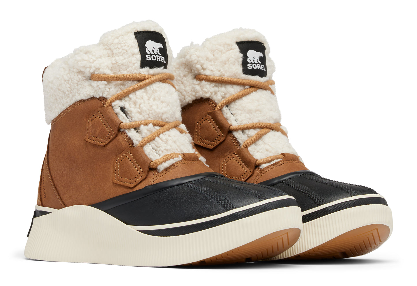 Pair of winter boots with black toe caps, brown shafts, cream-colored sherpa collars, and platform soles.