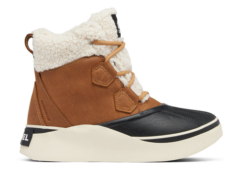 Tan and black SOREL waterproof boot with cream-colored shearling lining and laces, and a white platform sole.