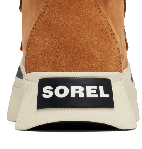Close-up of the back of a tan boot with a white sole and a black tag with white text that says "SOREL".
