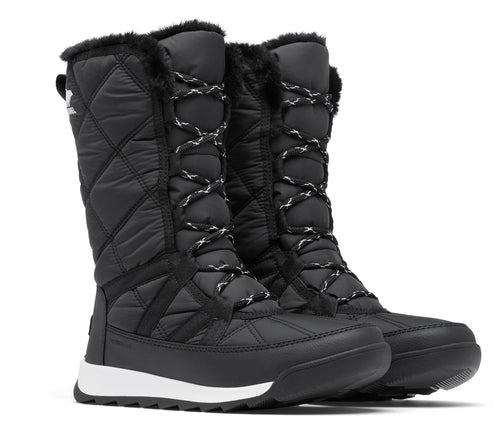 Pair of black quilted tall boots with lace-up fronts and faux fur trim.