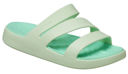 Light green sandal with two straps and a cross-strap with the word "Crocs" embossed on it.