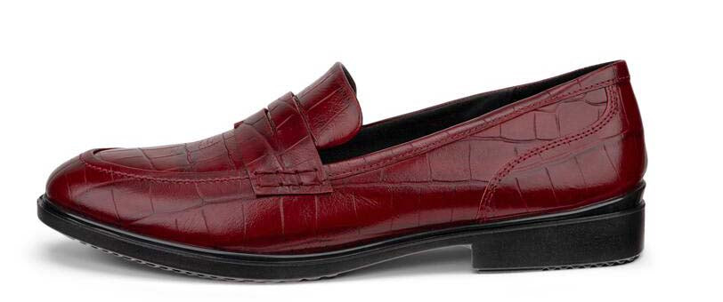 A red leather loafer shoe with a low black heel.